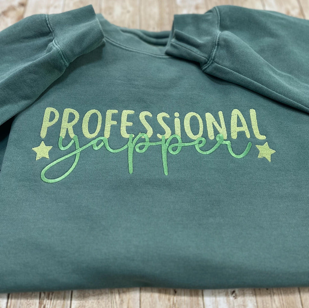 Professional Yapper. This cozy embroidered sweatshirt is perfect for the Yapper in your life.