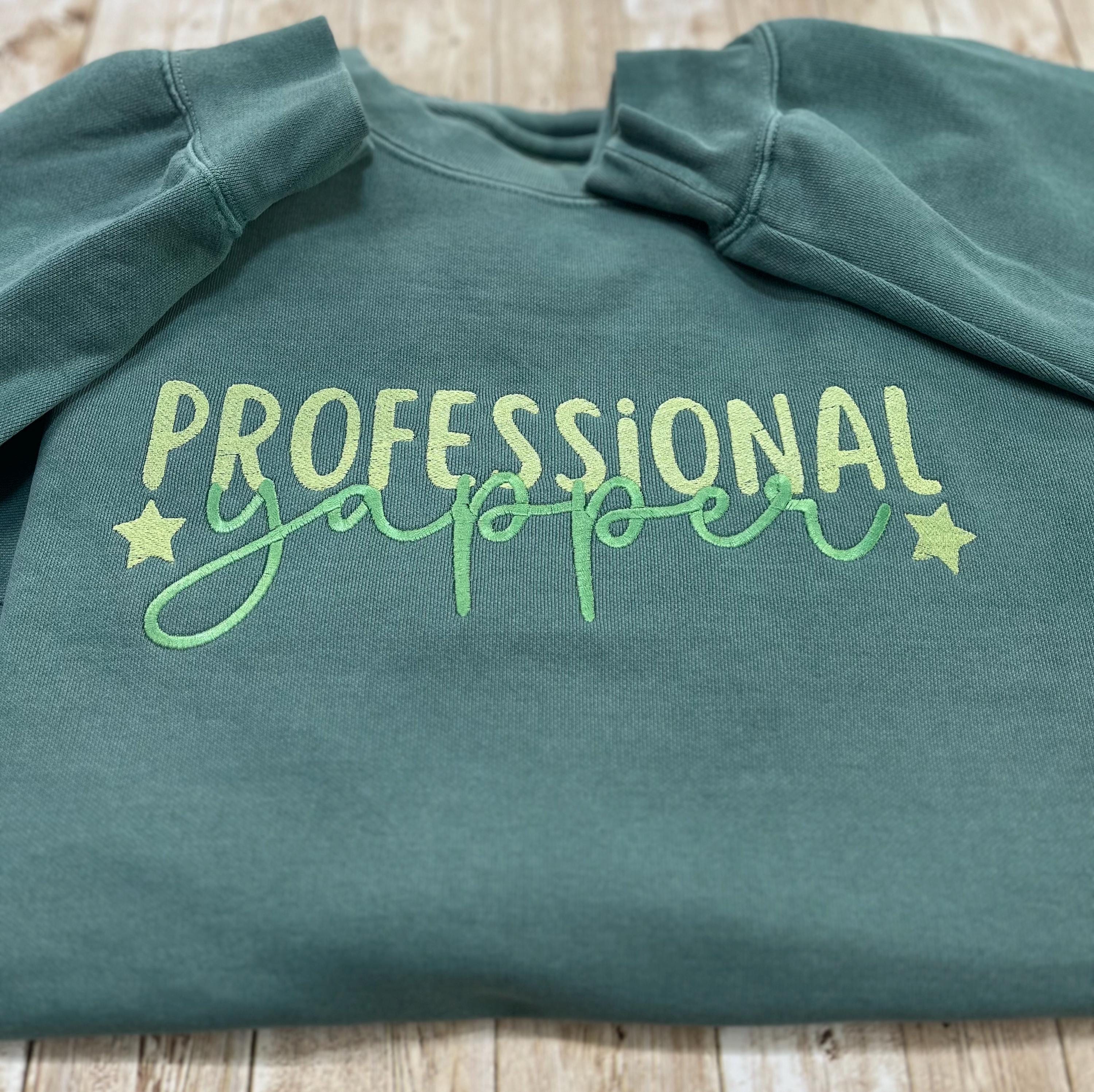 Professional Yapper. This cozy embroidered sweatshirt is perfect for the Yapper in your life.