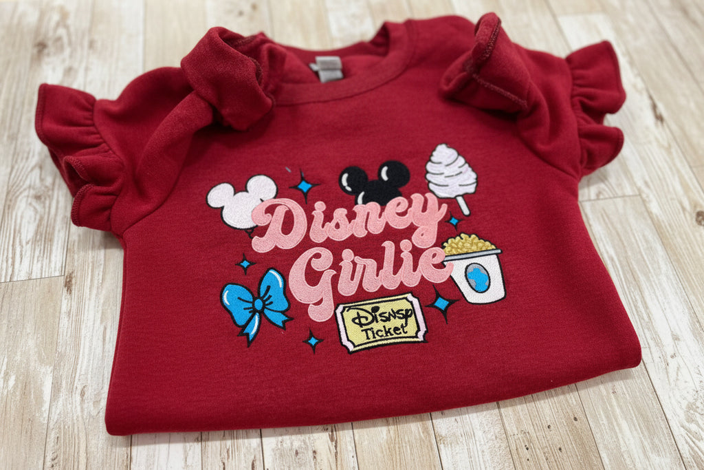 Disney girlie. Cozy embroidered Sweatshirt with sleeve embellishments. Featuring Disney classic icons. All the things you love Disney.