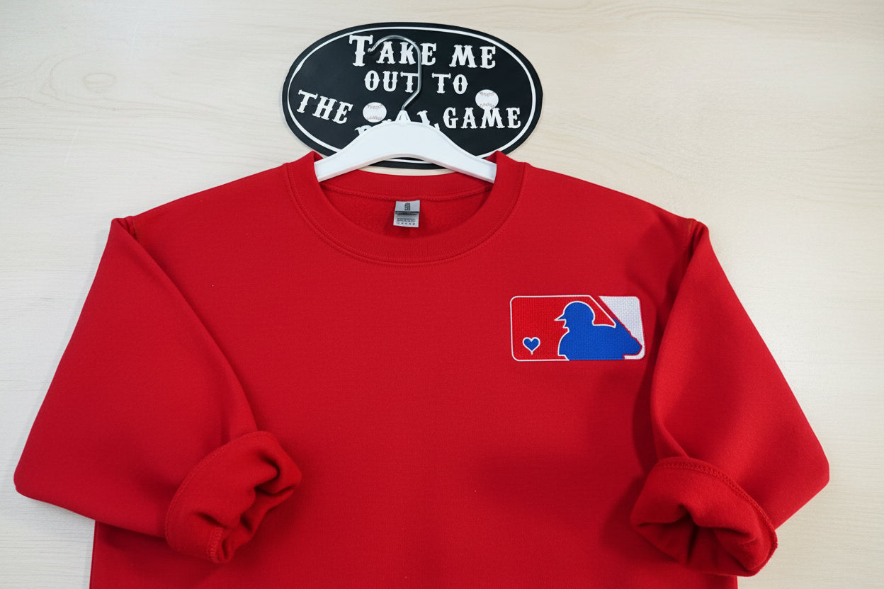 Love of Baseball Embroidered Sweatshirt. Classic outline of a baseball player and a heart logo is embroidered onto a soft & cozy sweatshirt.