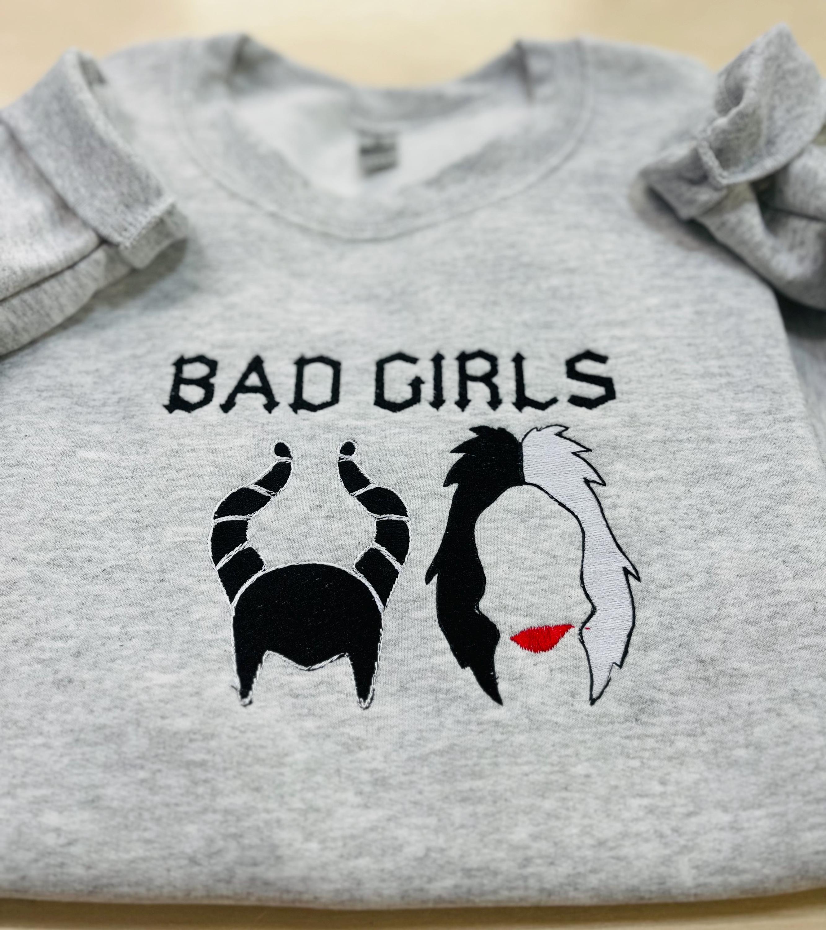 Disney villains Cruella Deville, and Maleficent “Bad Girls” sweatshirt.  Keeps you warm this fall season.