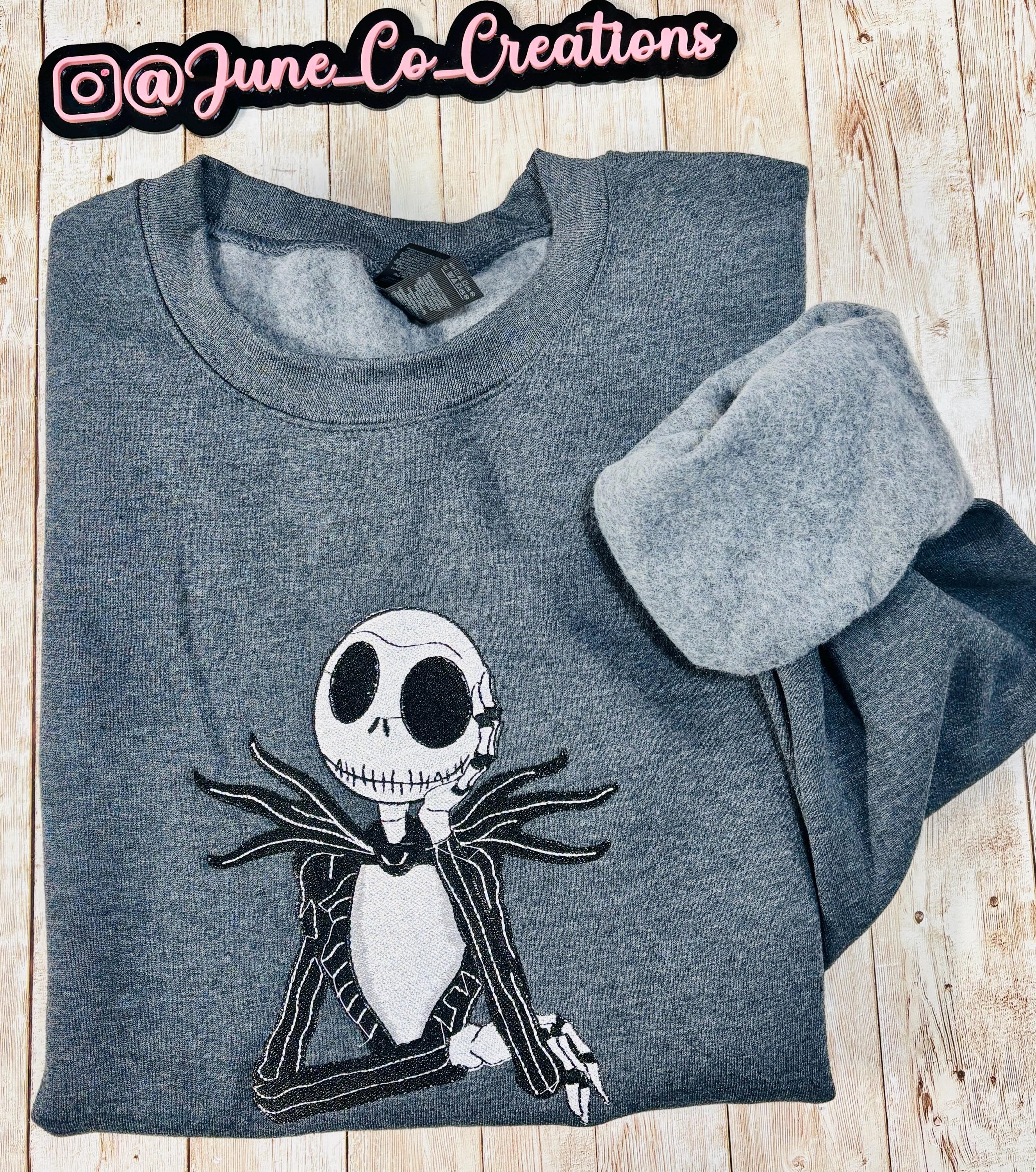 Celebrate the season with our cozy embroidered sweatshirt featuring Jack Skellington!