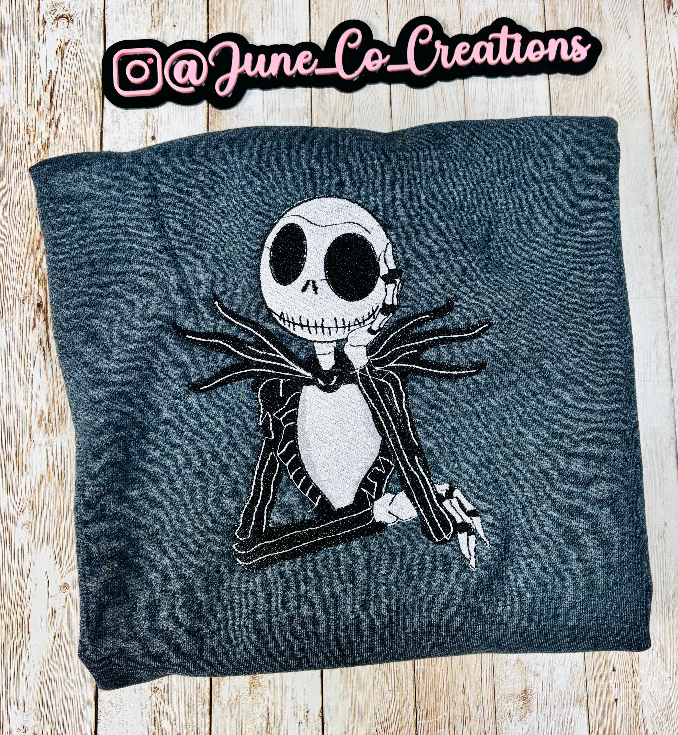 Celebrate the season with our cozy embroidered sweatshirt featuring Jack Skellington!