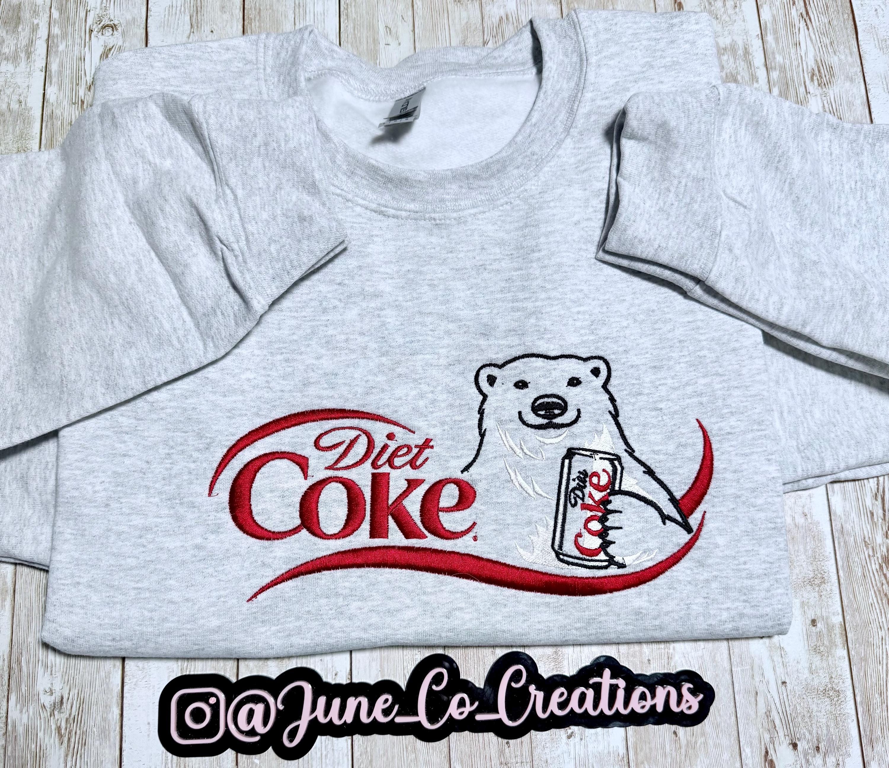 I need a Diet Coke polar bear embroidered cozy sweatshirt comes with a mini sized Diet Coke on the sleeve.