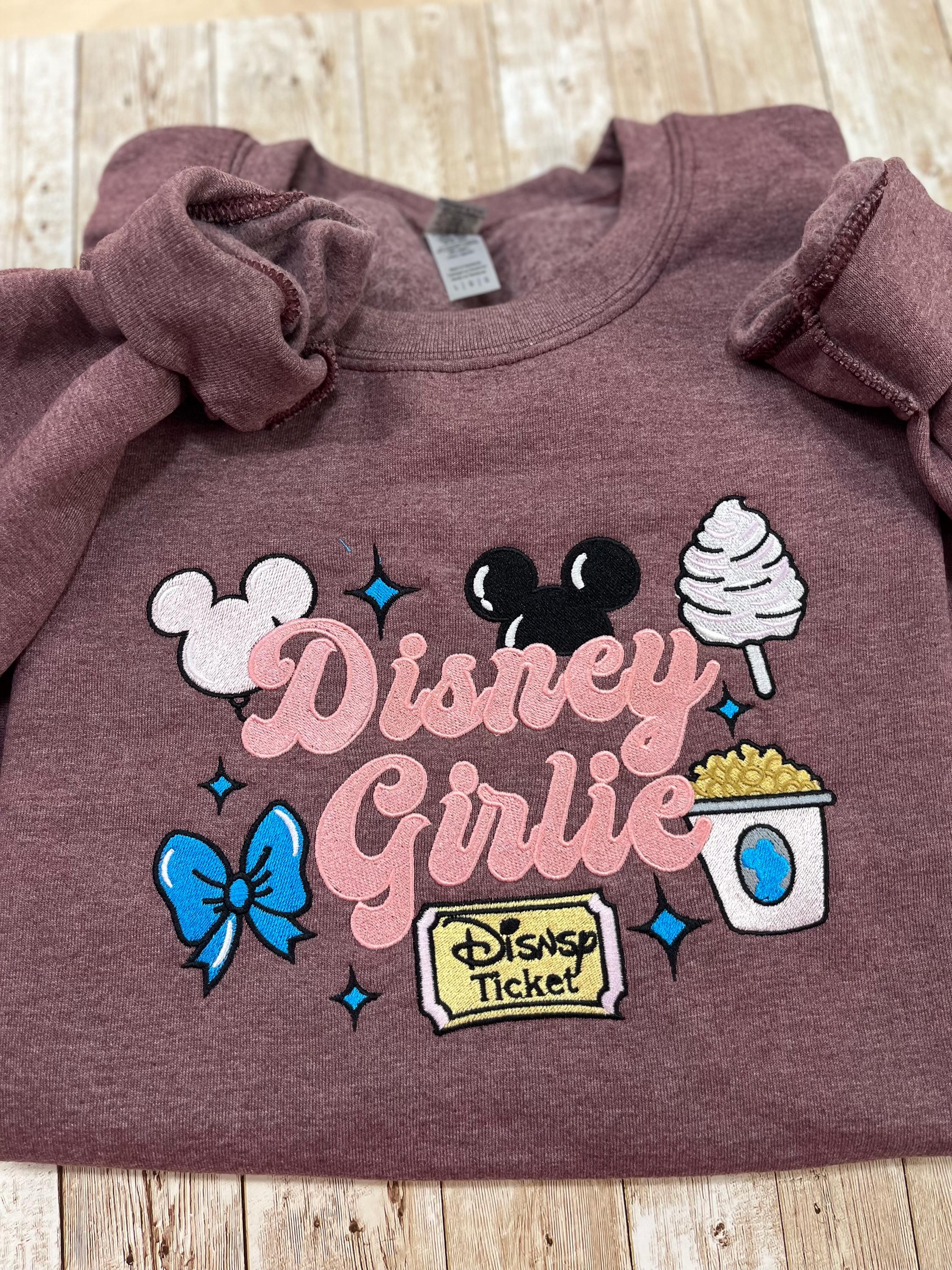 Disney girlie. Cozy embroidered Sweatshirt with sleeve embellishments. Featuring Disney classic icons. All the things you love Disney.