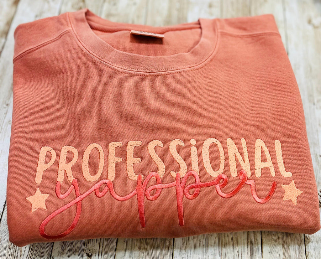 Professional Yapper. This cozy embroidered sweatshirt is perfect for the Yapper in your life.