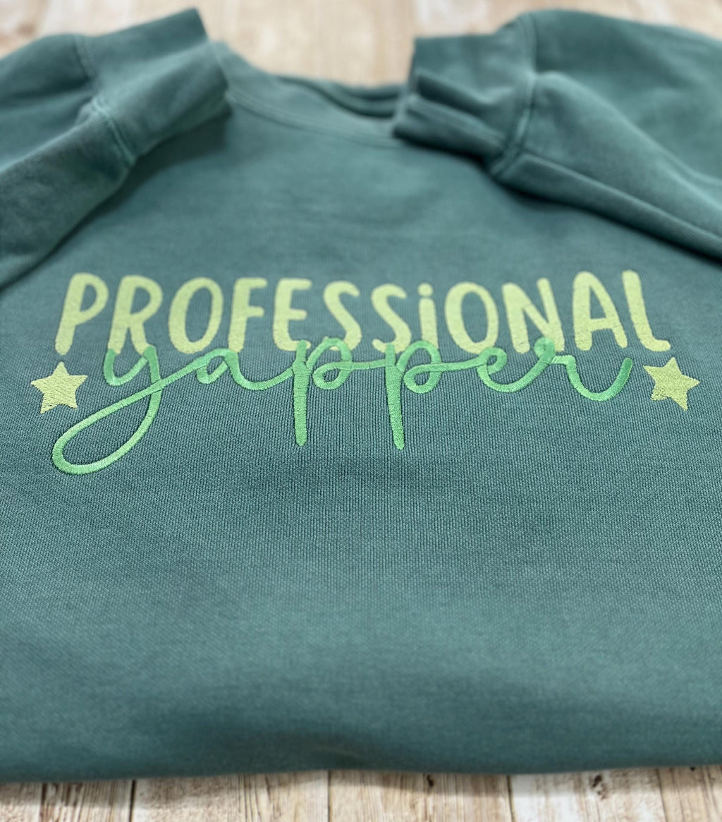 Professional Yapper. This cozy embroidered sweatshirt is perfect for the Yapper in your life.