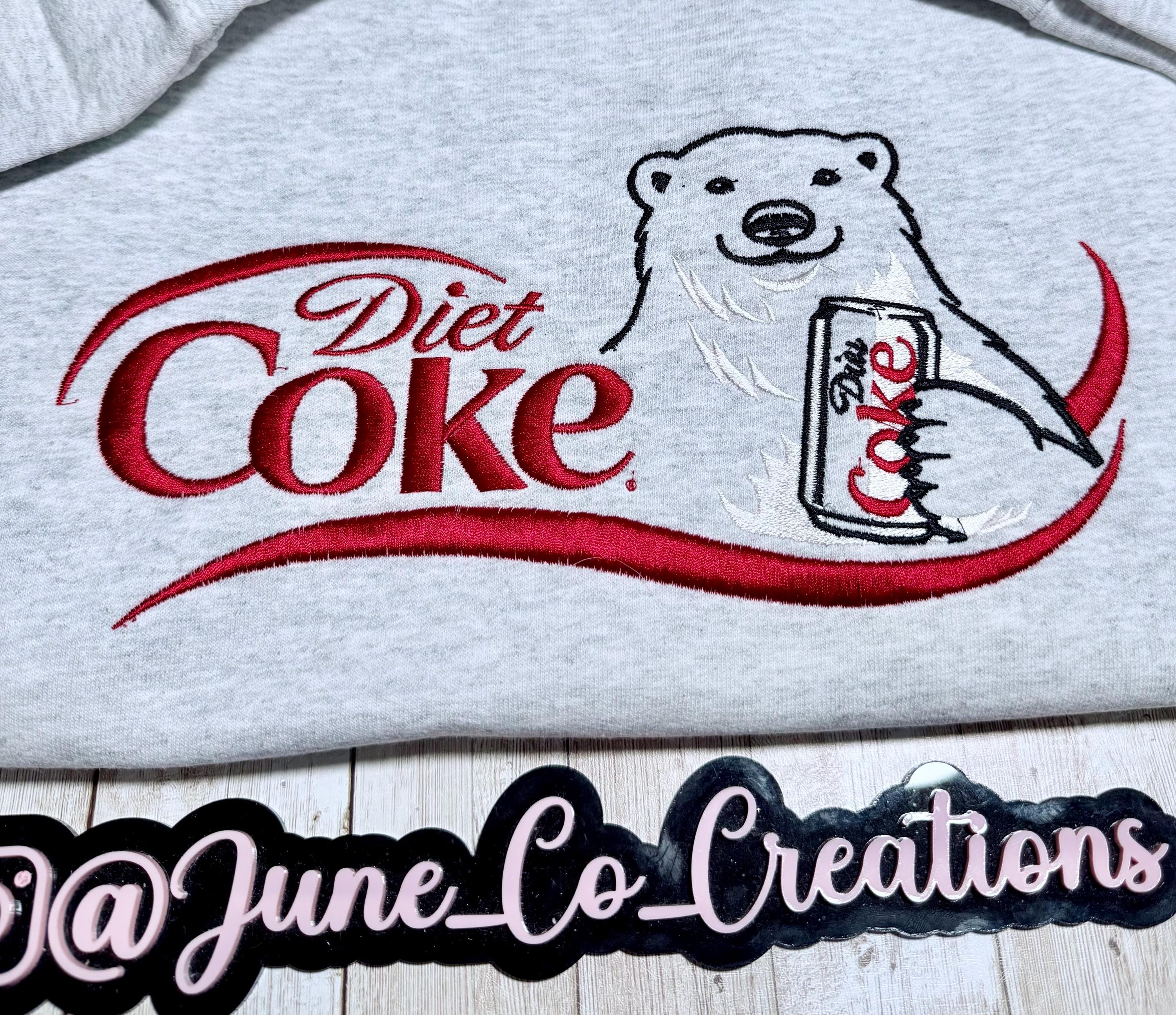 I need a Diet Coke polar bear embroidered cozy sweatshirt comes with a mini sized Diet Coke on the sleeve.