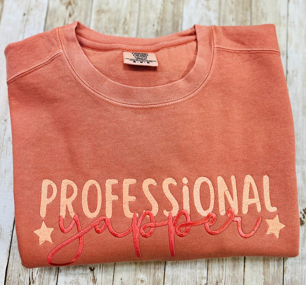 Professional Yapper. This cozy embroidered sweatshirt is perfect for the Yapper in your life.