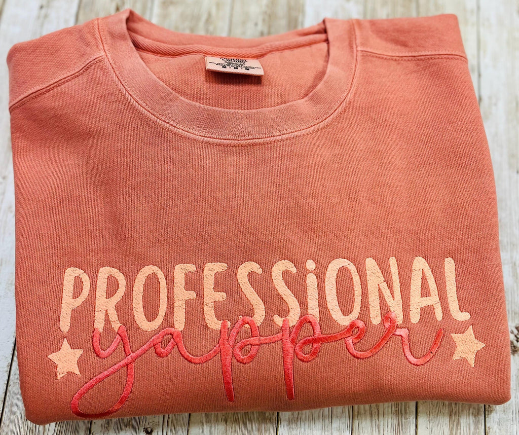 Professional Yapper. This cozy embroidered sweatshirt is perfect for the Yapper in your life.