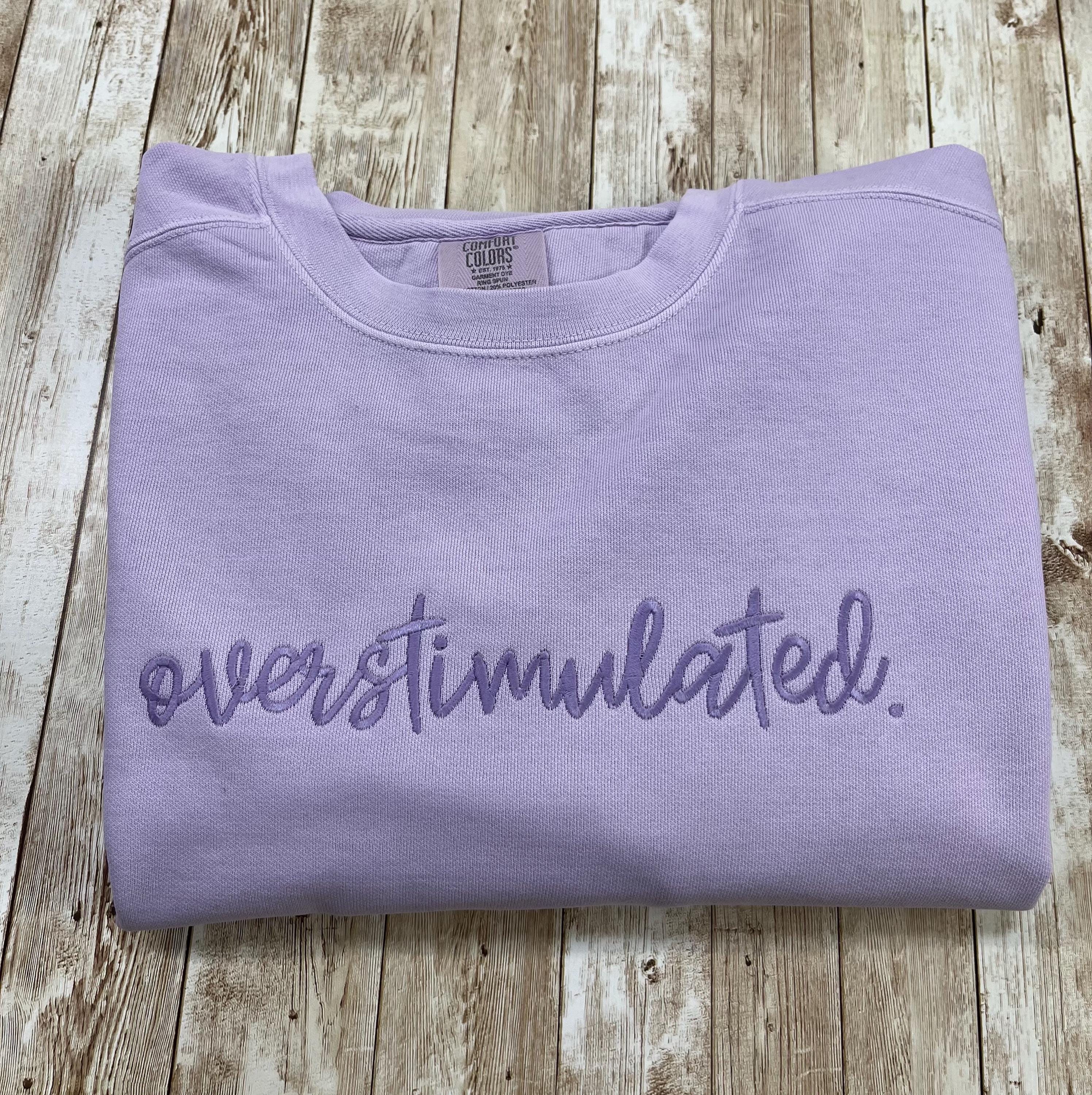 Overstimulated. This cozy embroidered sweatshirt is cozy and cute! custom made to Order using comfort colors sweatshirt
