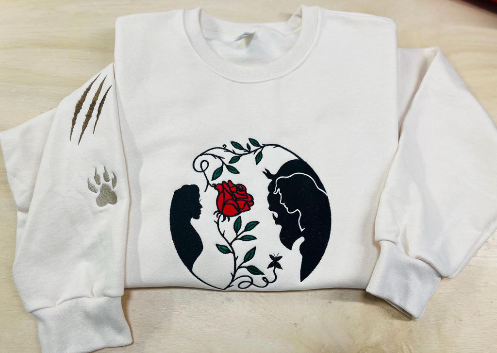 Beauty and the Beast. Cozy embroidered Sweatshirt with sleeve embellishments. A Disney classic fairytale. Featuring the famous Rose.