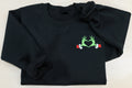 Show your Grinch Love with this Embroidered Sweatshirt. Featuring The Grinch hands shaped like a heart.