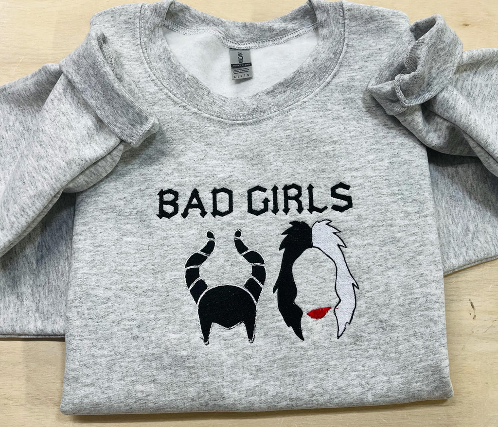 Disney villains Cruella Deville, and Maleficent “Bad Girls” sweatshirt.  Keeps you warm this fall season.