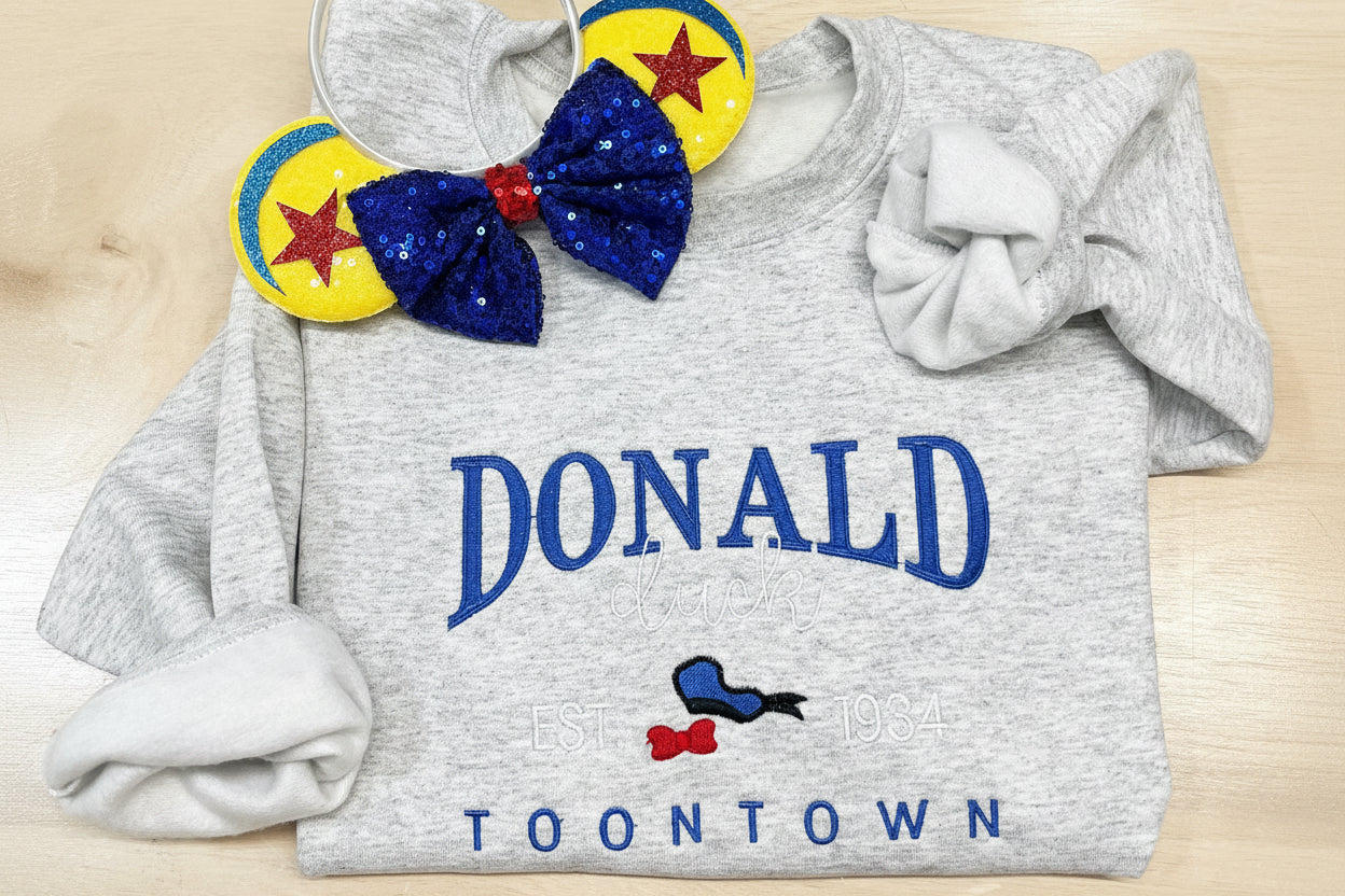 Donald Duck Embroidered Sweatshirt. Soft and Cozy stitched with vibrant colors. Famous Duck.