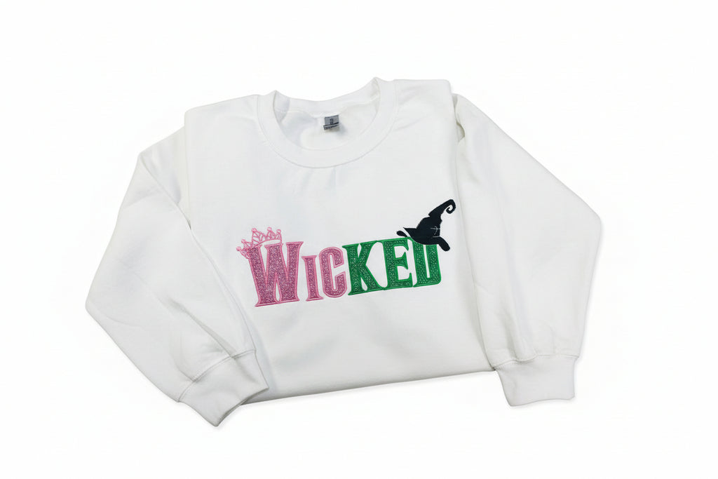 Youth WICKED! This sparkly, Wicked embroidered sweatshirt is perfect for Youth. Complete with sleeve embellishment Broom and Wand Vinyl