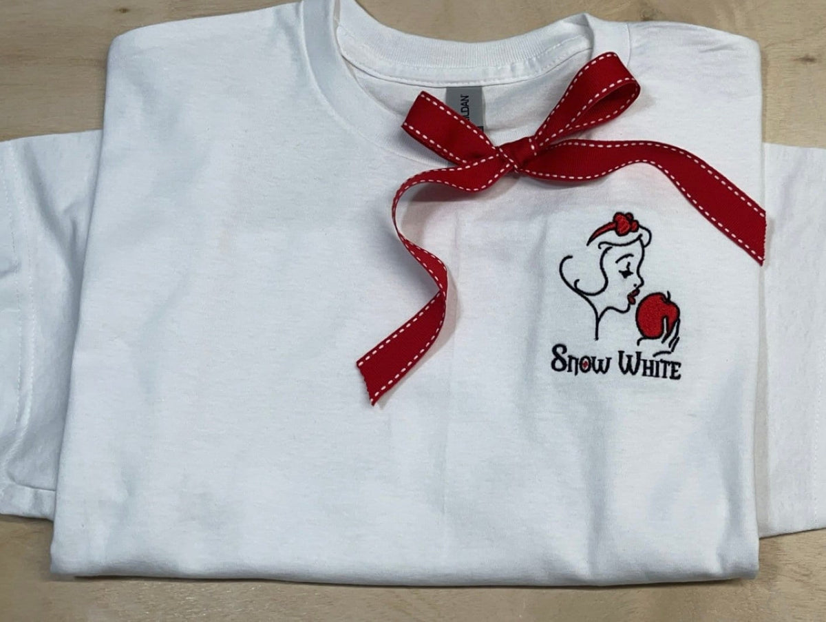 Snow White Disney princess with poison apple. Embroidered on a T-Shirt. Perfect for your Disney vacation or a gift for a Disney Fan.