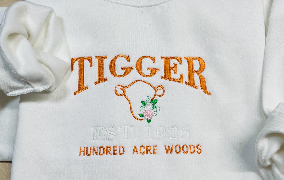 Tigger Soft & Cozy Embroidered Sweatshirt. Beautifully designed featuring Hundred Acre Woods.