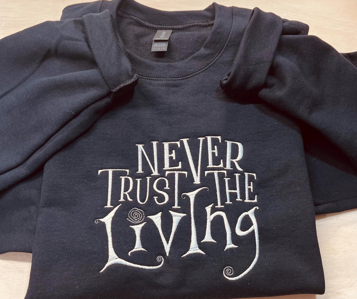 Coraline Embroidered Sweatshirt: "Never Trust The Living" Fall Apparel