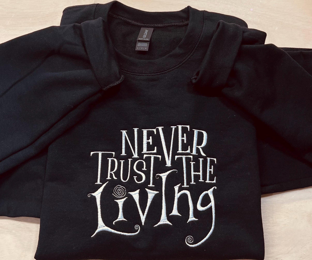Coraline Embroidered Sweatshirt: "Never Trust The Living" Fall Apparel