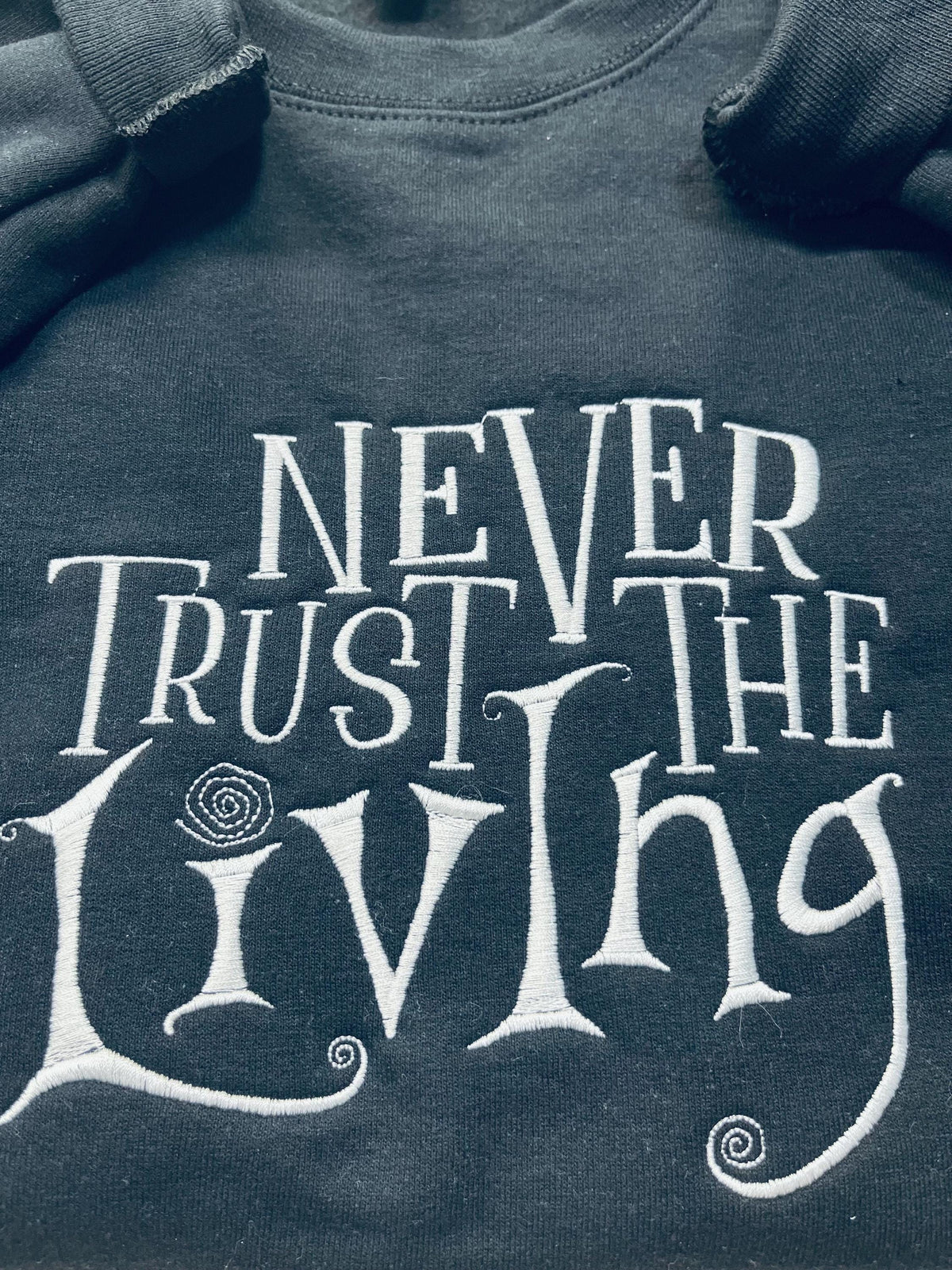 Coraline Embroidered Sweatshirt: "Never Trust The Living" Fall Apparel