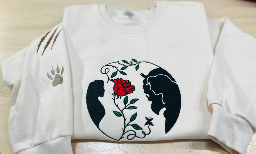 Beauty and the Beast. Cozy embroidered Sweatshirt with sleeve embellishments. A Disney classic fairytale. Featuring the famous Rose.