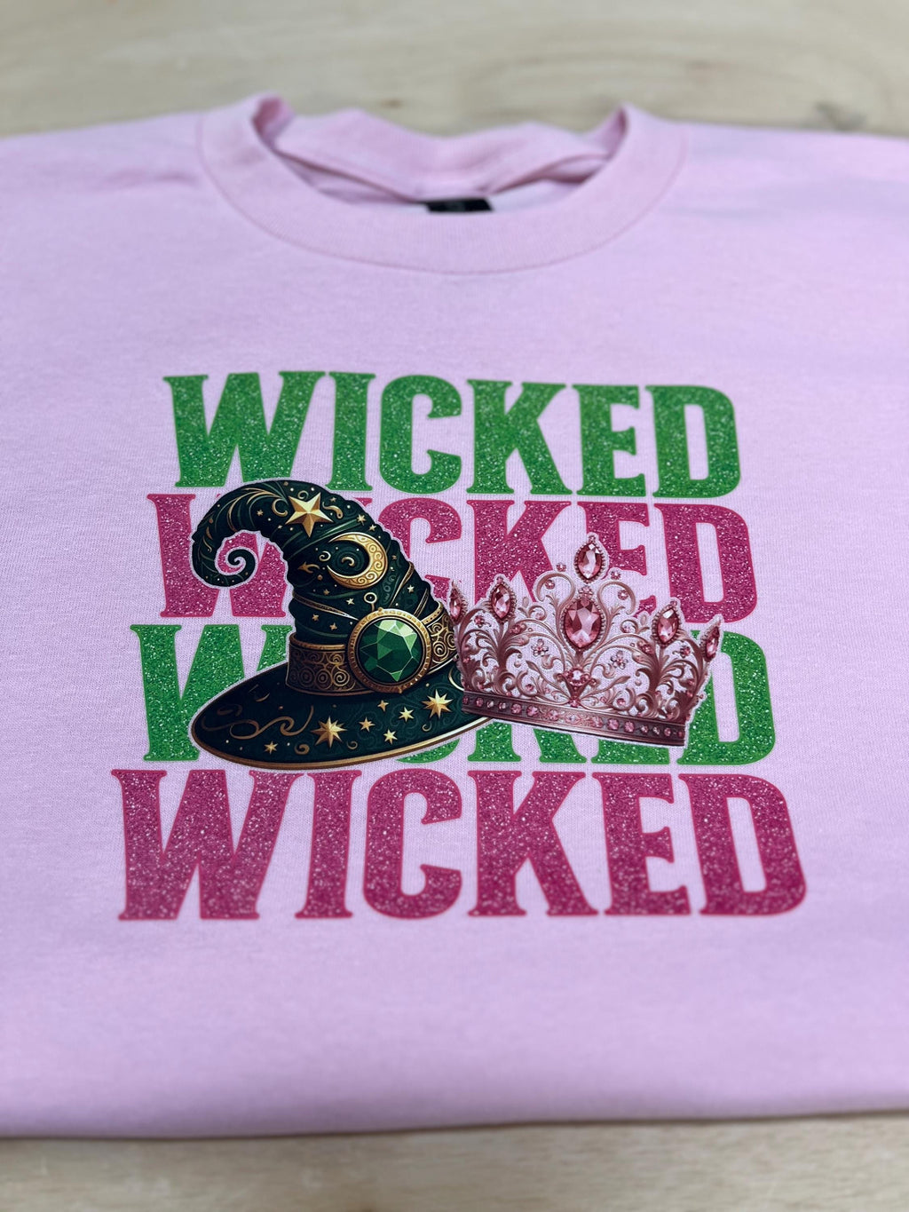 Youth WICKED! This sparkly, Wicked iron on T-Shirt is perfect for Youth. Complete with sleeve embellishment Broom and Wand Vinyl