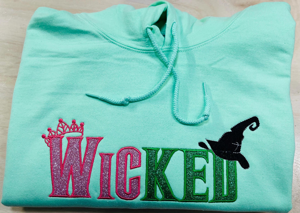 Youth WICKED! This sparkly, Wicked embroidered sweatshirt is perfect for Youth. Complete with sleeve embellishment Broom and Wand Vinyl