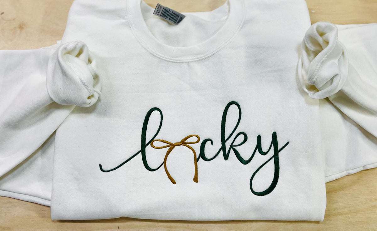 St. Patrick's Day Embroidered "LUCKY" Sweatshirt with a gold bow. Cozy & Stylish Irish Charm