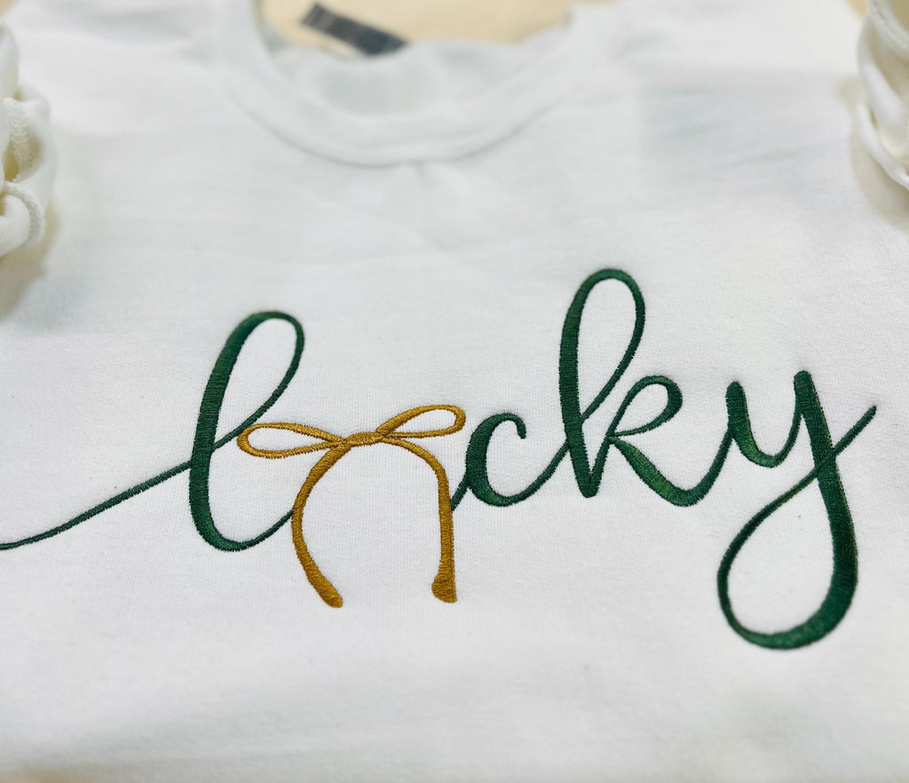 St. Patrick's Day Embroidered "LUCKY" Sweatshirt with a gold bow. Cozy & Stylish Irish Charm