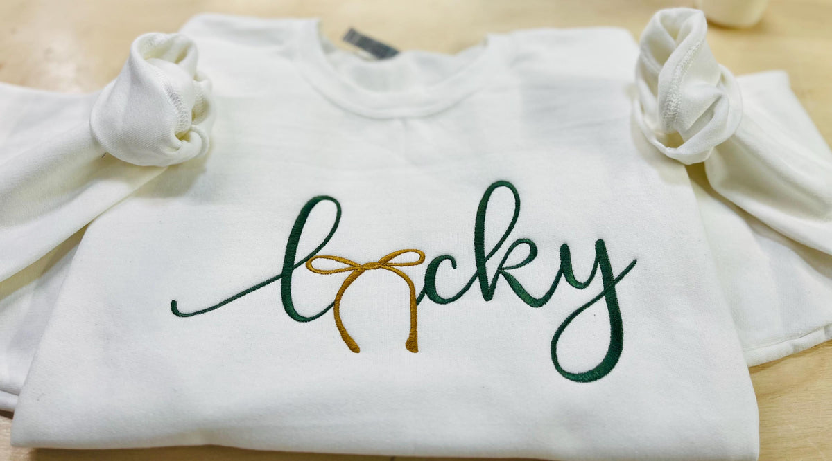 St. Patrick's Day Embroidered "LUCKY" Sweatshirt with a gold bow. Cozy & Stylish Irish Charm