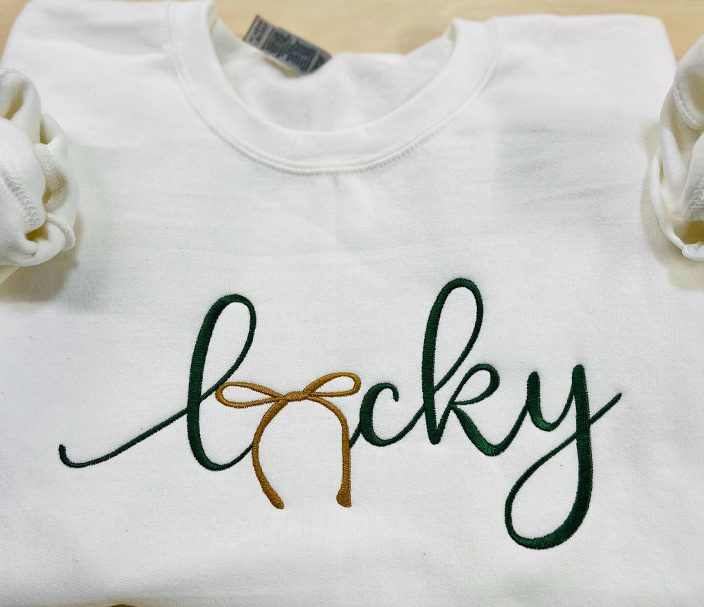 St. Patrick's Day Embroidered "LUCKY" Sweatshirt with a gold bow. Cozy & Stylish Irish Charm