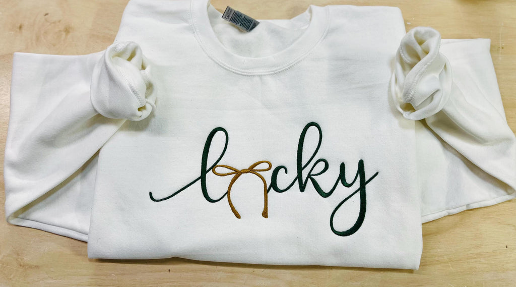 St. Patrick's Day Embroidered "LUCKY" Sweatshirt with a gold bow. Cozy & Stylish Irish Charm