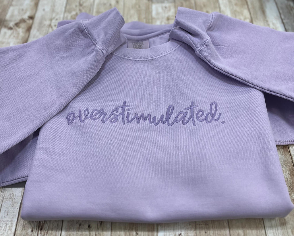 Overstimulated. This cozy embroidered sweatshirt is cozy and cute! custom made to Order using comfort colors sweatshirt