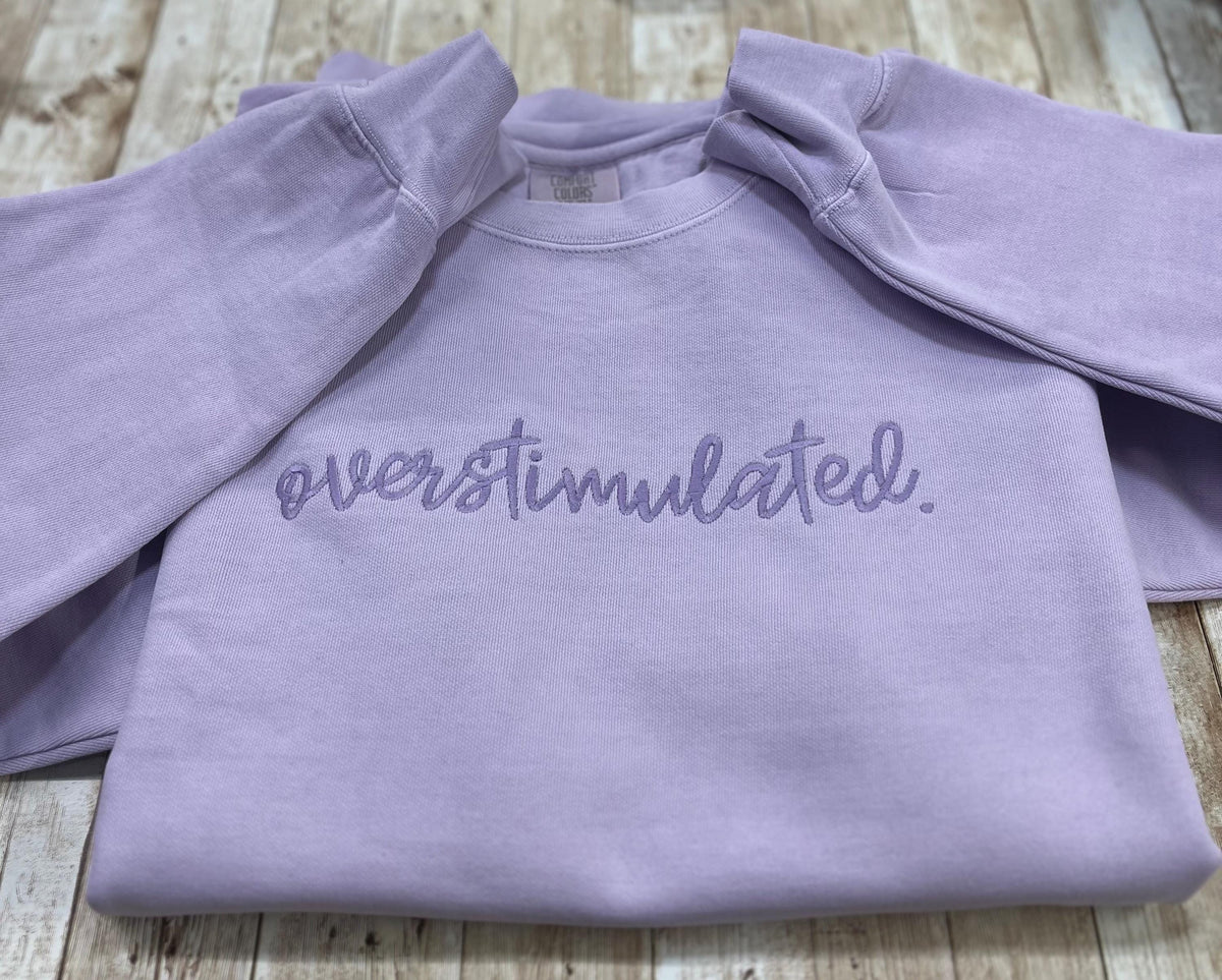 Overstimulated. This cozy embroidered sweatshirt is cozy and cute! custom made to Order using comfort colors sweatshirt