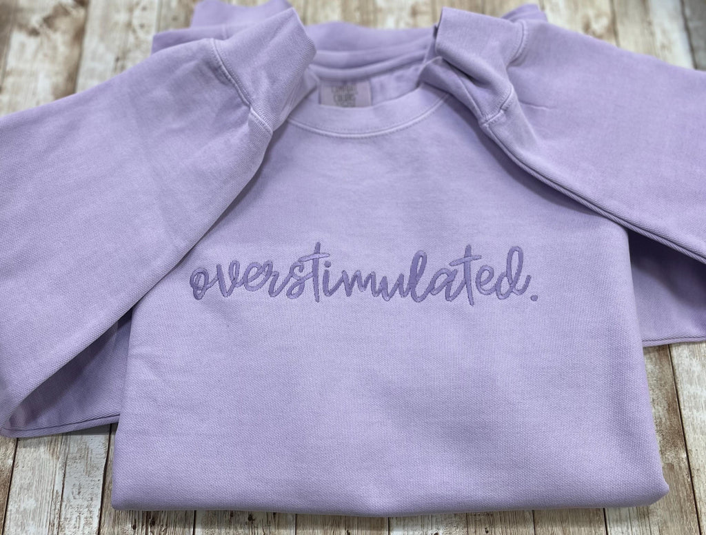Overstimulated. This cozy embroidered sweatshirt is cozy and cute! custom made to Order using comfort colors sweatshirt