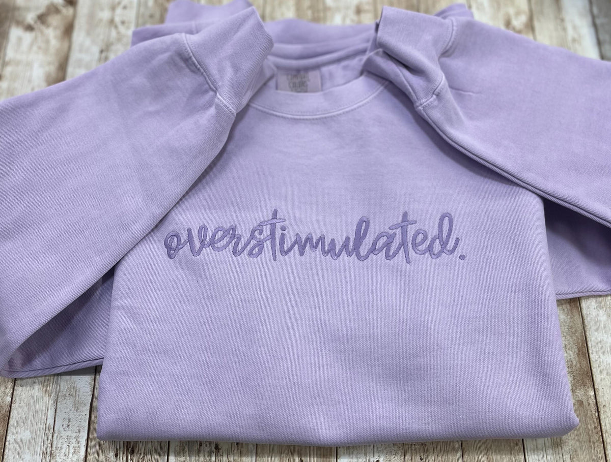 Overstimulated. This cozy embroidered sweatshirt is cozy and cute! custom made to Order using comfort colors sweatshirt