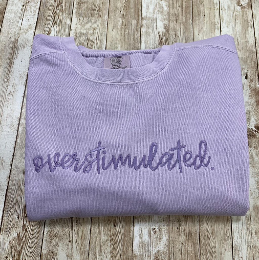Overstimulated. This cozy embroidered sweatshirt is cozy and cute! custom made to Order using comfort colors sweatshirt