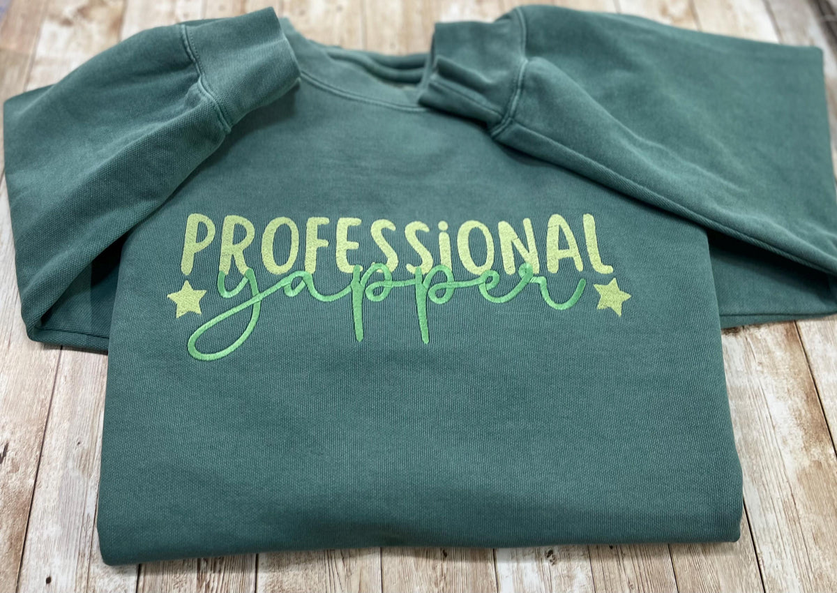 Professional Yapper. This cozy embroidered sweatshirt is perfect for the Yapper in your life.