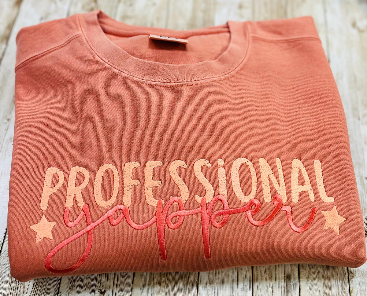 Professional Yapper. This cozy embroidered sweatshirt is perfect for the Yapper in your life.