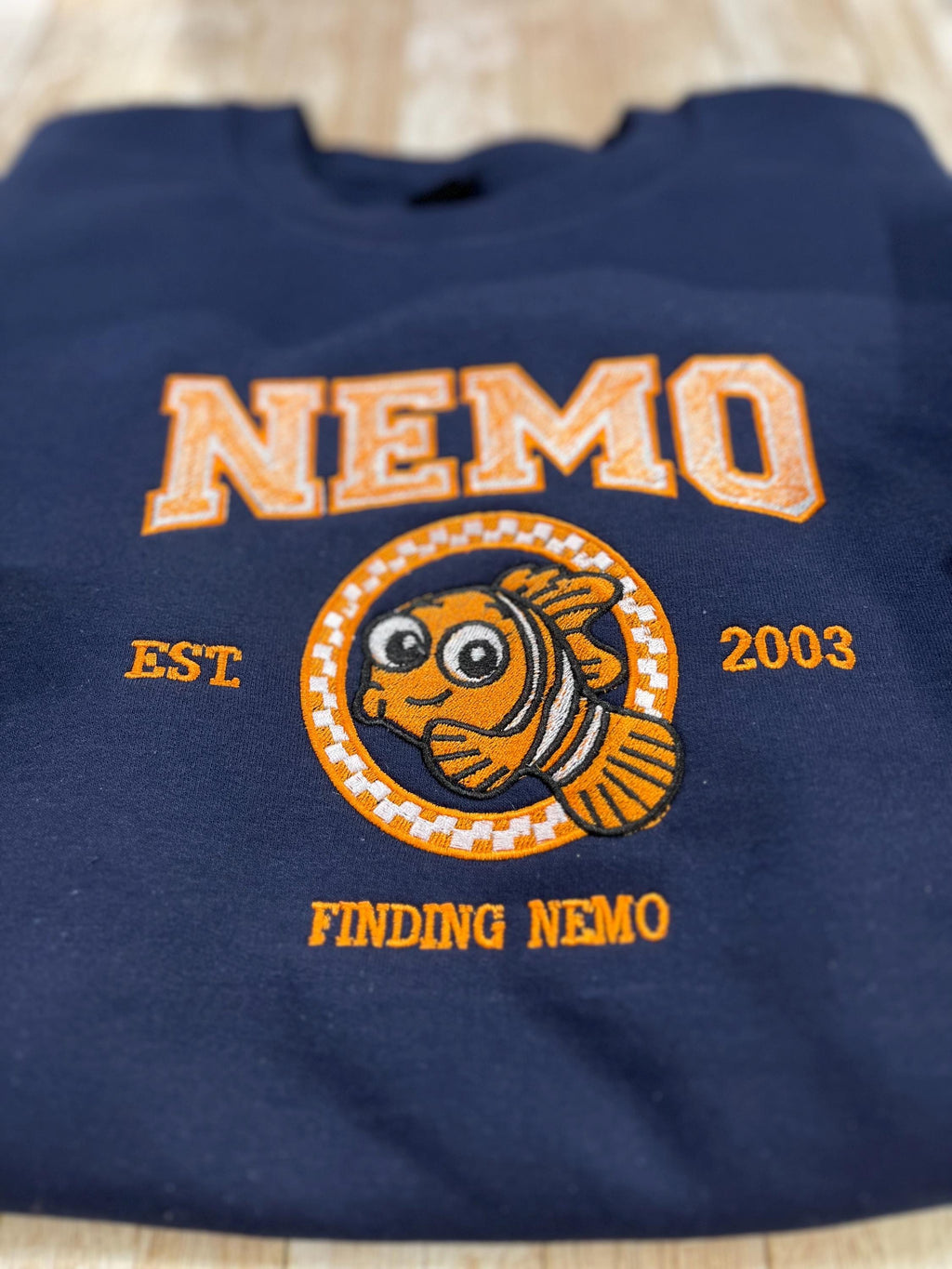 NEMO! Finding Nemo embroidered sweatshirt. For those Disney Nemo fans. This Vibrant sweatshirt is adorable.