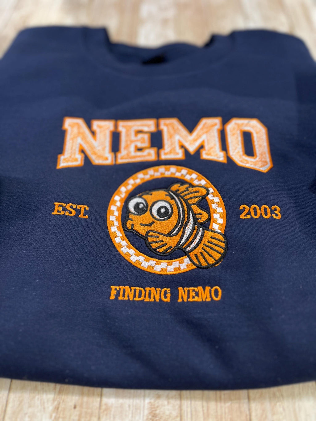 NEMO! Finding Nemo embroidered sweatshirt. For those Disney Nemo fans. This Vibrant sweatshirt is adorable.