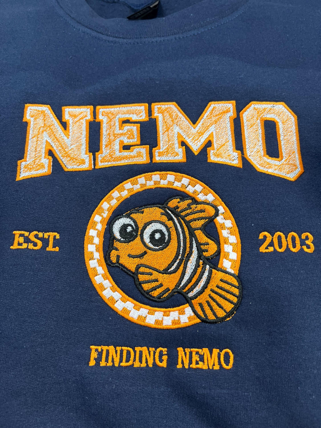 NEMO! Finding Nemo embroidered sweatshirt. For those Disney Nemo fans. This Vibrant sweatshirt is adorable.