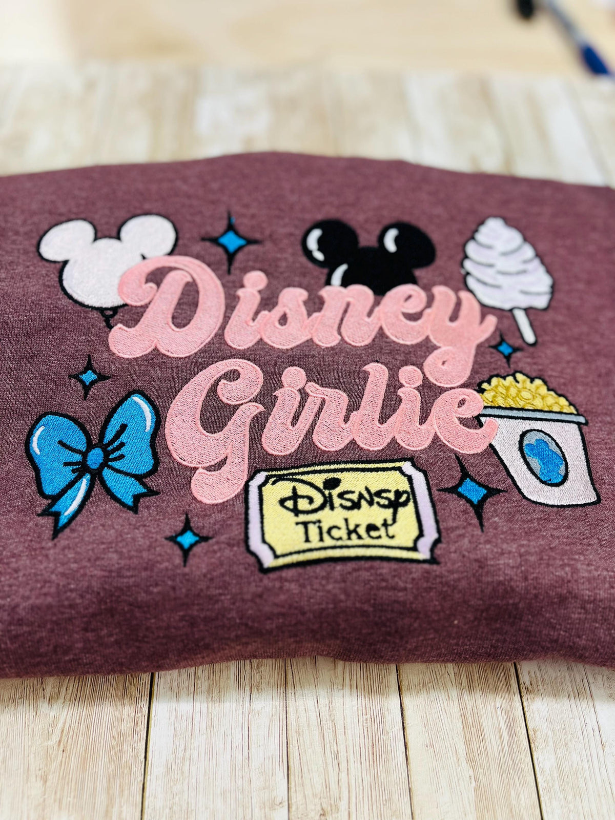 Disney girlie. Cozy embroidered Sweatshirt with sleeve embellishments. Featuring Disney classic icons. All the things you love Disney.
