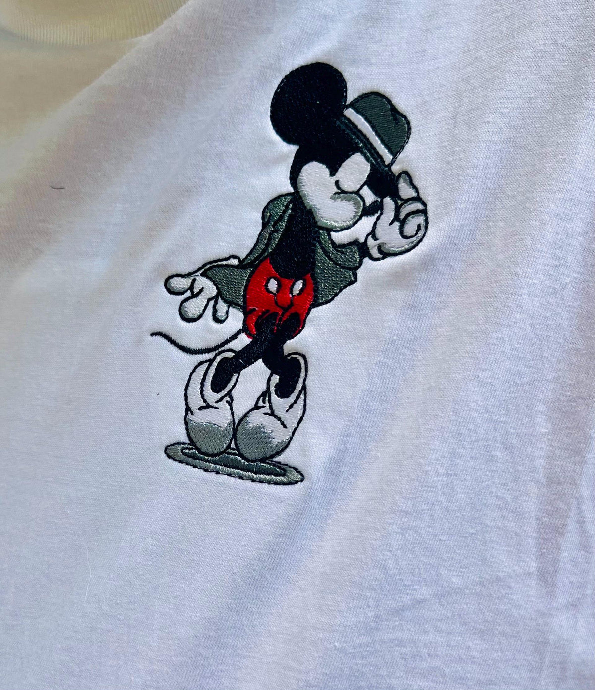 Classic Mickey Mouse. Pocket design of Mickey and his dance pose.