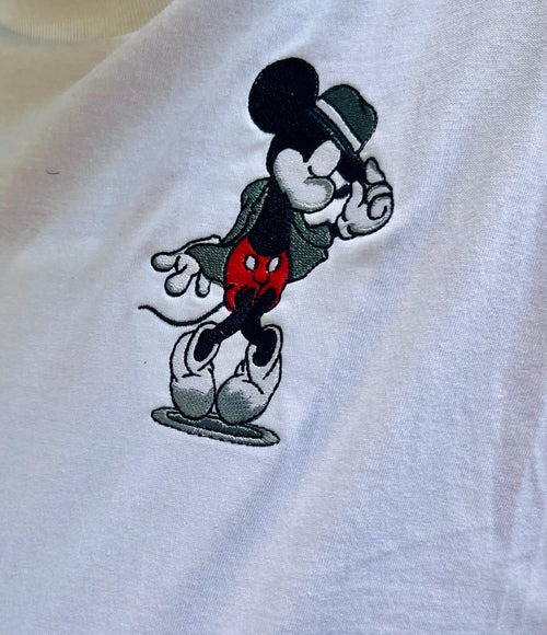 Classic Mickey Mouse. Pocket design of Mickey and his dance pose.