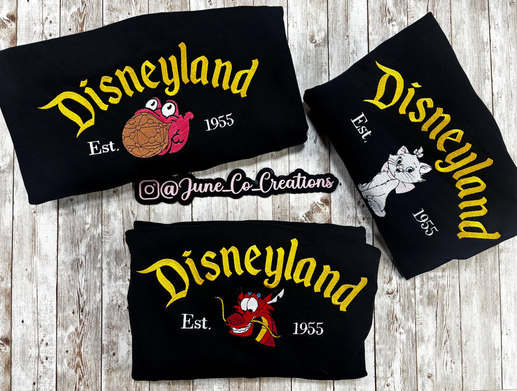 Disneyland Character. Cozy embroidered Sweatshirt. Featuring Disney classic icons. All the things you love Disney.
