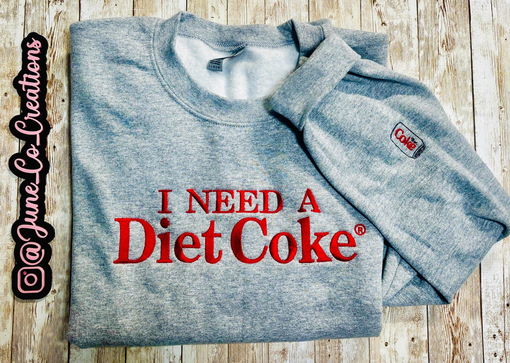 I need a Diet Coke embroidered sweatshirt. Cozy sweatshirt with a mini Diet Coke embellishment on the sleeve