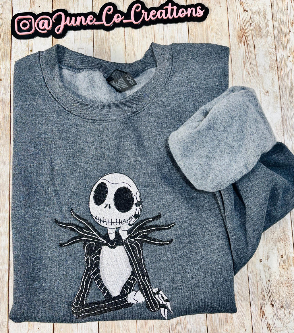 Celebrate the season with our cozy embroidered sweatshirt featuring Jack Skellington!