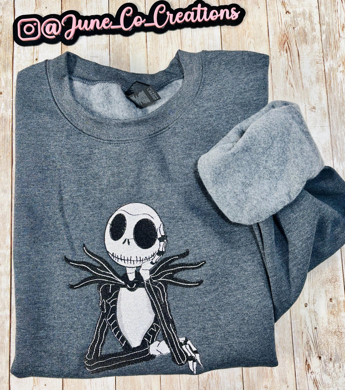 Celebrate the season with our cozy embroidered sweatshirt featuring Jack Skellington!